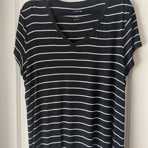 Women's check short sleeve black and white striped shirt.